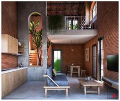 a living room filled with furniture and a flat screen tv mounted on a wall next to a kitchen