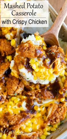 mashed potato casserole w / crispy chicken in a white dish with a wooden spoon