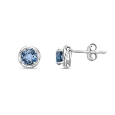 Top off your casual attire with a pop of vibrant color when you wear these round blue topaz swirl frame stud earrings in silver. Created in sterling silver Each earring showcases sculpted swirling ribbons highlighting the 5.0mm London blue topaz center stone. These post earrings secure comfortably with friction backs. London Blue Topaz, Casual Attire, London Blue, Sterling Silver Earrings Studs, Blue Topaz, Post Earrings, Sterling Silver Earrings, Topaz, Swirl