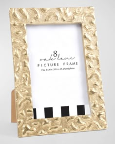 an ornate gold frame with black and white stripes