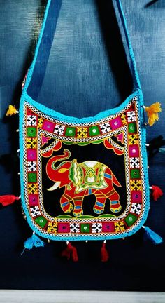 Convertible hand band and shoulder bag Festival Embroidered Multicolor Hobo Bag, Handmade Blue Shoulder Bag For Festivals, Multicolor Hobo Shoulder Bag For Festival, Colorful Rectangular Shoulder Bag For Festivals, Colorful Bohemian Shoulder Bag With Adjustable Strap, Festival Multicolor Embroidered Hobo Bag, Traditional Blue Shoulder Bag For Festivals, Multicolor Festival Satchel Shoulder Bag, Multicolor Shoulder Bag For Beach Festivals