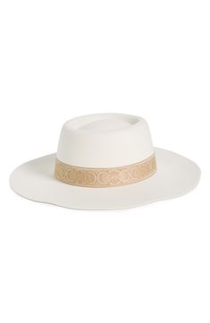 A wide brim and dented crown defines a classic boater hat crafted from felty fabric and finished with a novelty hat band. Textile Spot clean Imported White Brimmed Felt Hat For Kentucky Derby, White Western Boater Hat With Curved Brim, Elegant White Fedora With Flat Crown, White Western Boater Hat For Rodeo, White Boater Hat For Rodeo, Classic White Felt Hat For Summer, White Curved Brim Boater Hat For Rodeo, White Boater Hat With Curved Brim For Rodeo, White Flat Brim Felt Hat For Summer