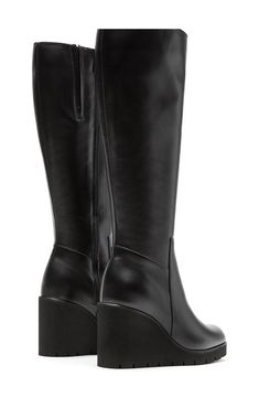 A subtle platform and wedge heel lift a knee-high leather boot crafted with City Dry technology that ensures you stay warm and dry through the cooler seasons. Waterproof: protects against rain, puddles and slush to keep feet dry in wet conditions 3 1/2" heel; 1" platform 14 1/4" shaft; 13 1/2" calf circumference Memory foam cushioning with arch support XL EXTRALIGHT® sole is lightweight, flexible and shock absorbent Leather upper/textile lining/rubber sole Made in Canada Black Knee High Wedge Boots, Knee High Wedge Boots, Black Knees, Knee High Leather Boots, Leather Boot, Wedge Boots, Arch Support, Wedge Heels, Stay Warm