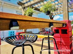 two chairs sitting on top of a wooden table