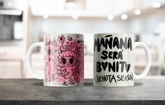 two coffee mugs sitting on top of a counter