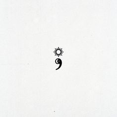 a black and white drawing of a sun with a face on it's side