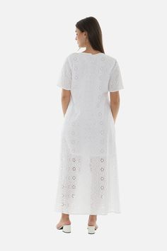 Look stunning this summer in the White Eyelet Half-Sleeve V-Neck Maxi Dress. This breezy piece is made of lightweight fabric and features a sophisticated half-sleeve with a v-neck cut that is sure to flatter your figure. Complete your chic style with simple flats or elegant wedges for an effortless, yet glamorous look.