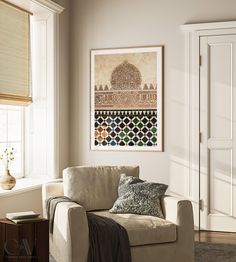 a living room filled with furniture and a painting hanging on the wall over a window