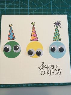 three birthday cards with googly eyes and hats