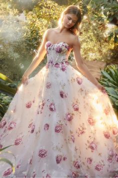 This strapless organza peony print ball gown is a breathtaking and romantic choice for any fairytale garden. This strapless bodice is a full, floor-length skirt made of delicate layered organza fabric. The gown features a stunning peony print that adds a pop of color to the off white background. A sheer boned bodice is adorned with coordinating hot stones for some added glitz. The detachable puff sleeves give you the option to change up the look and add a touch of drama to the design. Long Puff Sleeve Dress, Andrea And Leo, Strapless Organza, Fairytale Garden, Peony Print, Boned Bodice, Hot Stones, Unique Prom Dresses, Vintage Floral Dress