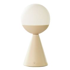 a white table lamp sitting on top of a wooden base with a round light fixture