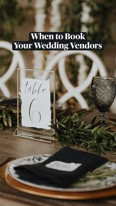 the table is set with place cards and napkins