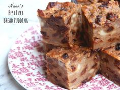 a plate topped with brownies on top of a white and red flowered plate