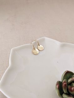 "Elevate your seasonal style with these 100% 14k gold filled asymmetrical leaf earrings. Available in both 10mm and 13mm sizes, these nature-inspired pieces add a touch of minimalist elegance. Choose between 14k gold filled French hooks or sleek lever-back ear wires for added comfort and security. * Tiny 10mm (3/8\") discs OR * Small 13mm (1/2\") discs * 100% 14k YELLOW gold-filled (includes ear wires!) * French hook ear wires with tiny ball at the top with rubber stoppers (Or lever backs) SILVE Minimalist Hypoallergenic Earrings In Recycled Gold, Minimalist Hypoallergenic Recycled Gold Earrings, Minimalist Everyday Earrings In Recycled Gold, Everyday Minimalist Earrings In Recycled Gold, Dainty Gold Earrings For Everyday, Dainty Hypoallergenic Recycled Gold Earrings, Simple 14k Gold Filled Everyday Earrings, Everyday Rose Gold Brass Earrings, Tiny Delicate Gold-plated Earrings