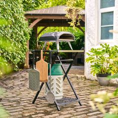 an outdoor grill with two cooking utensils on it