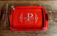 a red personalized serving tray on a wooden table