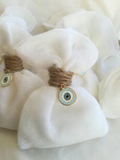 two white bags with blue eyes on them