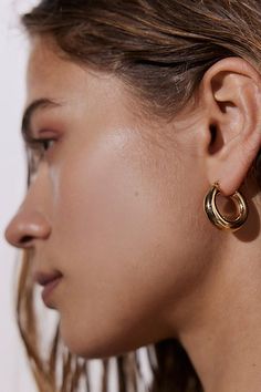 Forever fave tube hoop earrings in an essential everyday mid-size hoop earring silhouette we love. Features Essential medium tube hoop earrings Chunky tube hoop earrings Medium hoop size Content + Care Mixed metal Avoid contact with water Imported | Essential Medium Tube Hoop Earring in Gold, Women's at Urban Outfitters Hoop Earrings Medium, Hoop Earrings Chunky, Tube Hoop Earrings, Medium Hoop Earrings, Mid Size, Mixed Metals, Women Accessories Jewelry, Lifestyle Photography, Metallic Silver