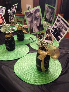 three mason jars with flowers and pictures on them are sitting on a green placemat