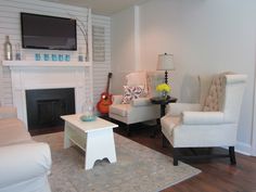 the living room is clean and ready for guests to come home with their new furniture