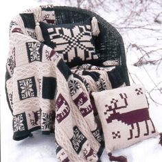 blankets and pillows are sitting in the snow