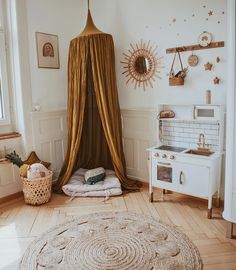 a room with a bed, rug and other items on the floor