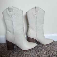 Mid Calf White/Ivory Textured Cowboy Boots. Originally Purchased From Altard State. Size 6. Perfect Condition Never Worn Trendy White Pointed Toe Mid-calf Boots, Chic Off White Boots For Fall, White Pointed Toe Mid-calf Boots Medium Width, White Pointed Toe Mid-calf Boots For Spring, White Leather Mid-calf Boots For Fall, White Mid-calf Boots With Pointed Toe, Cream Mid-calf Boots For Spring, Chic White Mid-calf Boots Medium Width, Chic White Mid-calf Boots For Spring