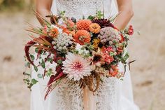 a woman holding a bouquet of flowers in her hands