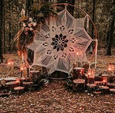 an outdoor wedding ceremony setup with candles and crocheted doily