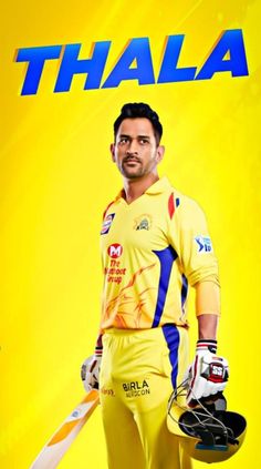 a man standing in front of a yellow background holding a cricket bat and helmet with the words thaala written on it