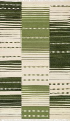 a green and white rug with stripes on it