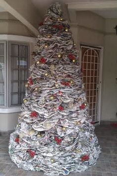 a large christmas tree made out of newspapers