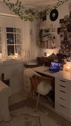 a desk with a laptop on it in a room