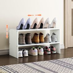 several pairs of shoes are lined up on a shelf in front of a door with an arrow pointing to the right