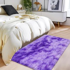 a bedroom with a purple rug on the floor