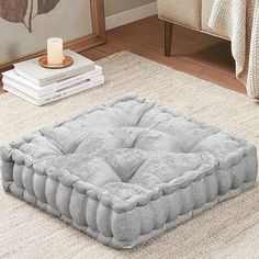 a dog bed sitting on top of a rug in a living room