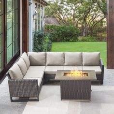 an outdoor fire pit sitting on top of a patio