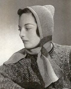 an old photo of a woman wearing a knitted hat with a scarf around her neck