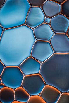 an abstract photograph of blue and orange tiles