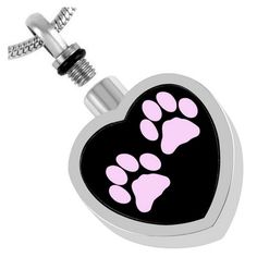 a dog paw print on a black and pink heart shaped keychain with diamond accents