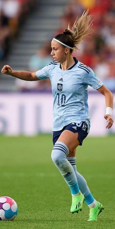 a female soccer player in action on the field