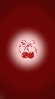 two cherries tied together with a bow on a red background that appears to be in the shape of a circle