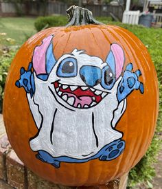 a pumpkin with an image of a cartoon character painted on it