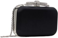 Structured satin clutch in black. · Detachable curb chain shoulder strap · Crystal-cut bow appliqué at clasp · Hinged closure · Grained leather lining · H4.5 x W8 x D2 Supplier color: Black Formal Clutch Bag With Bow, Formal Clutch With Bow Detail, Black Formal Bag With Bow, Formal Clutch With Bow, Formal Black Bag With Bow, Chic Black Evening Bag For Gala, Elegant Black Bag With Bow, Elegant Bags With Bow For Events, Elegant Black Clutch For Gala