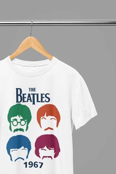 the beatles t - shirt on a hanger