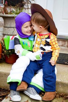 two young children sitting next to each other on a bench with the caption too cute to spook