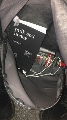 a book is in the pocket of a backpack