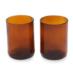 two brown glass vases sitting next to each other