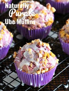 purple cupcakes with white frosting on a cooling rack and the words, naturally purple ube muffins