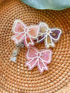 three bows are sitting on top of a wicker basket